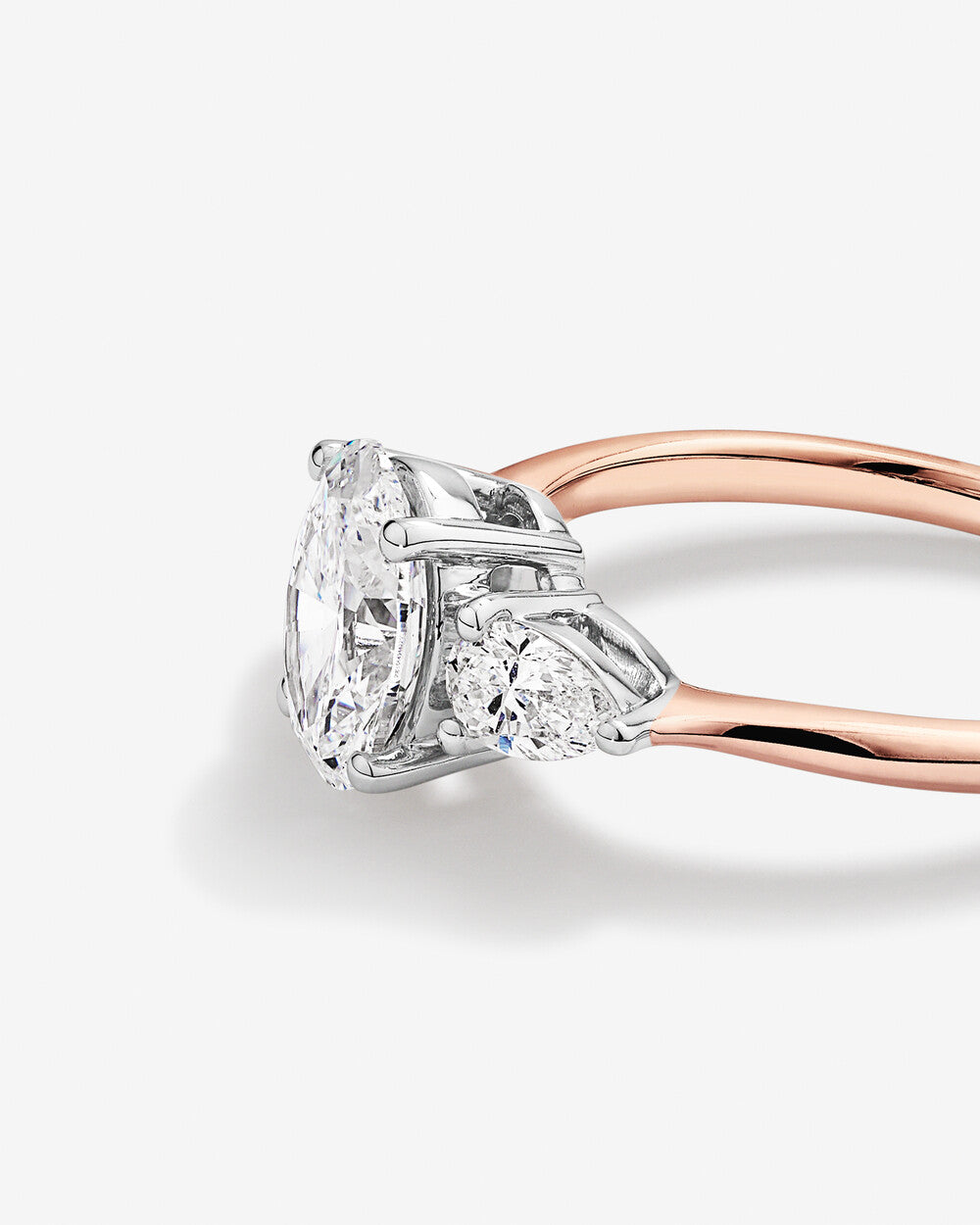 1.70 Carat TW Three Stone Oval and Pear Shaped Lab-Grown Diamond Engagement Ring in 14kt Rose and White Gold