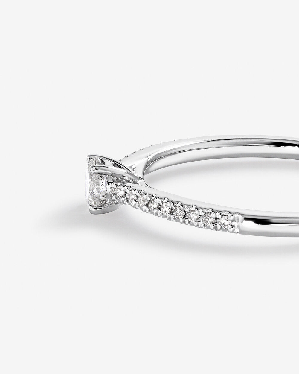 0.30 Carat TW Round Brilliant Diamond Side Accent Engagement Ring in 14k Gold